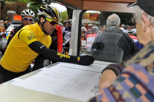 Hayden Roulston in yellow signs in at the start of stage 2.