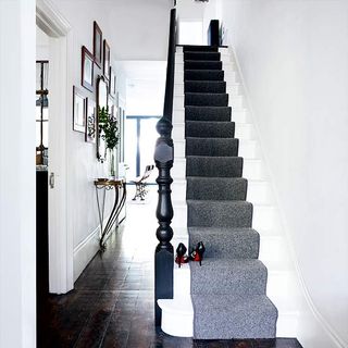 hallway with staircase and wall frame