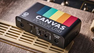 Walrus Audio Canvas Power USB: the latest in the pedal brand's pedalboard power supplies lineup is photographed against a fawn-colored Vox tube amp