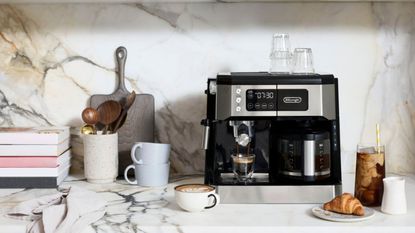 One of the best Cyber Monday coffee maker deals, the De'Longhi All-In-One Coffee Maker on a countertop
