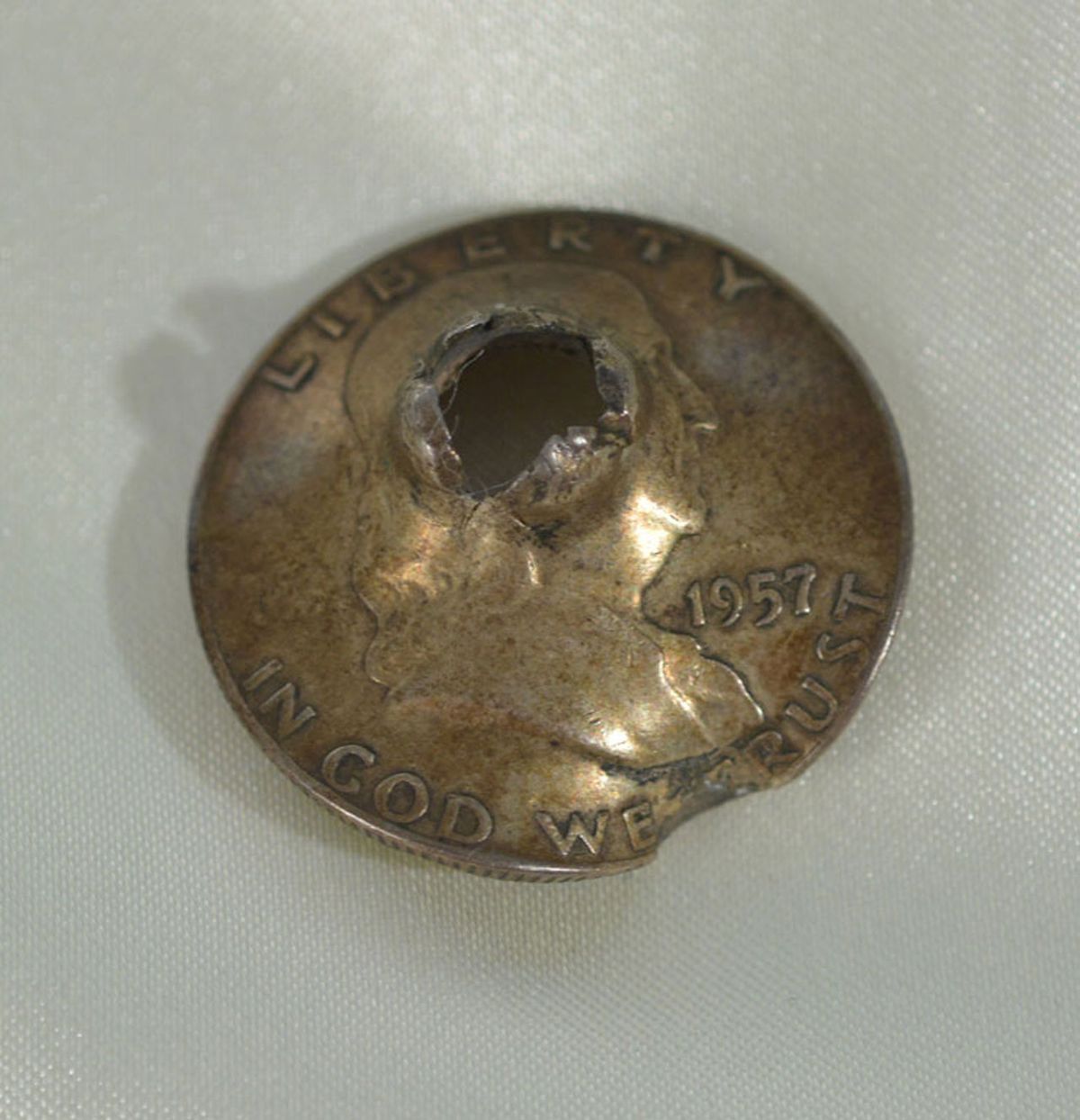 A coin. That someone shot. With a gun.