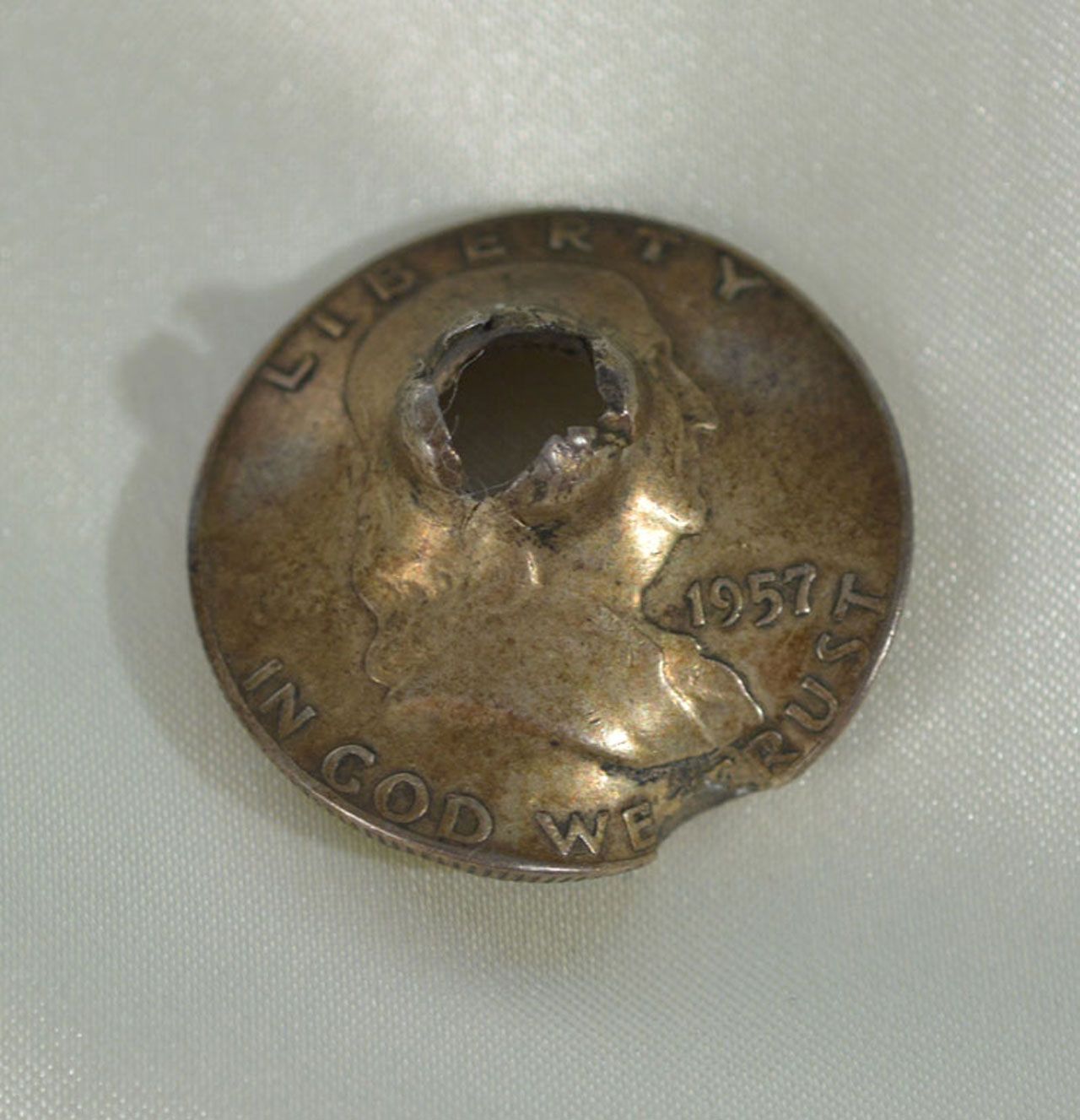 A coin. That someone shot. With a gun.