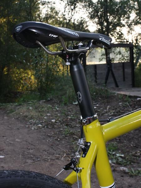 A stout two-bolt house-brand aluminum post secures the San Marco Zoncolan saddle whose smooth corners work well for 'cross remounts but ultra-narrow nose is a bit uncomfortable when you're on the rivet.