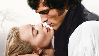promotional image featuring a romantic close-up of two people in 19th-century attire leaning in for a kiss against a hazy, pale background.