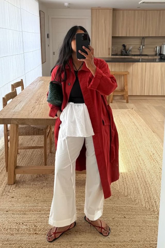 @monikh Dale wearing white petite wide leg trousers and a red coat