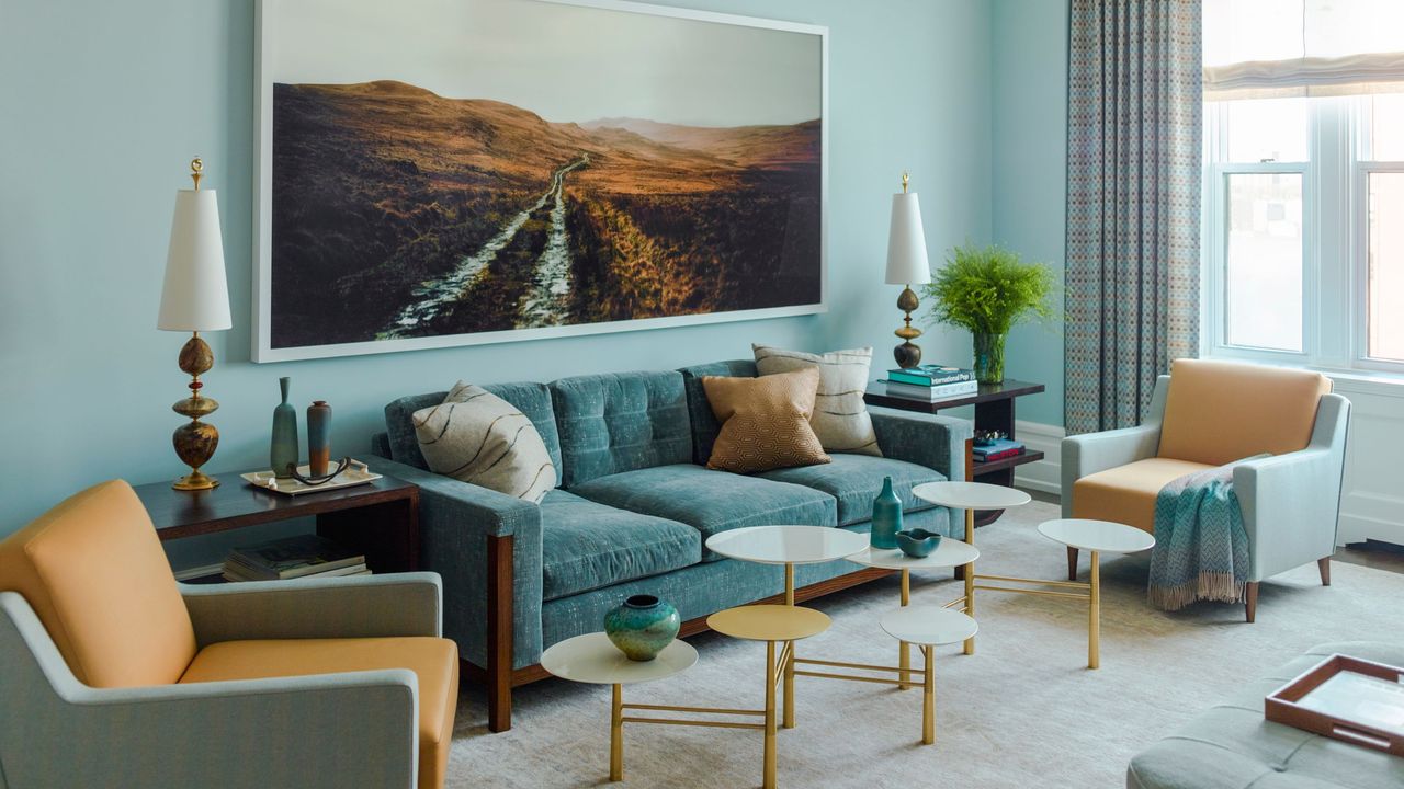 light blue living room with green couch