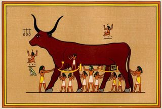 A giant red bull depicted on parchment or ancient cloth is tended to by many skirt-clad, long-haired individuals underneath.