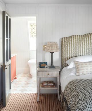 Grey bedroom with striped headboard