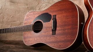 A Fender Paramount PM-1 acoustic guitar lying on its side