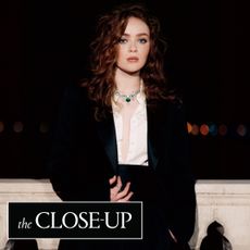 Sadie Sink poses on a bridge wearing armani and bulgari diamonds