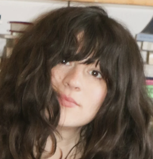 a white woman with dark brown hair