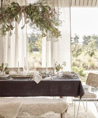 Thanksgiving table with scandi feel and foliage cloud above