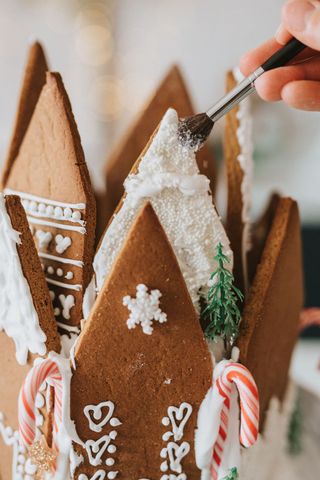 close up of gingerbread house roofs with royal icing
