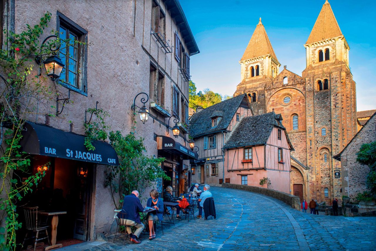 The small medieval village of Conques in France, with abbey-church and clustered houses topped by slate roofs. Just idyllic.