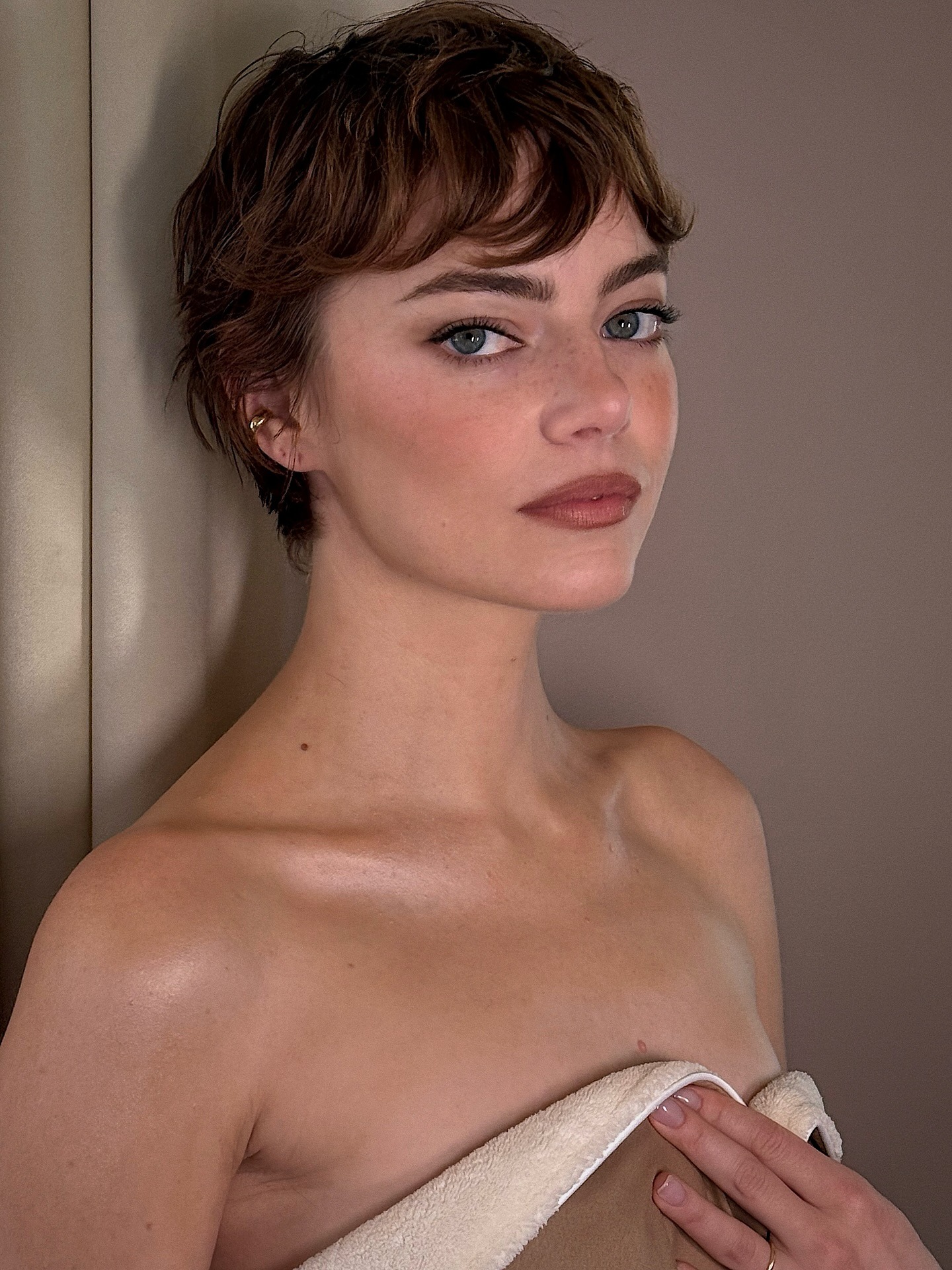 Emma Stone with short dark auburn pixie haircut
