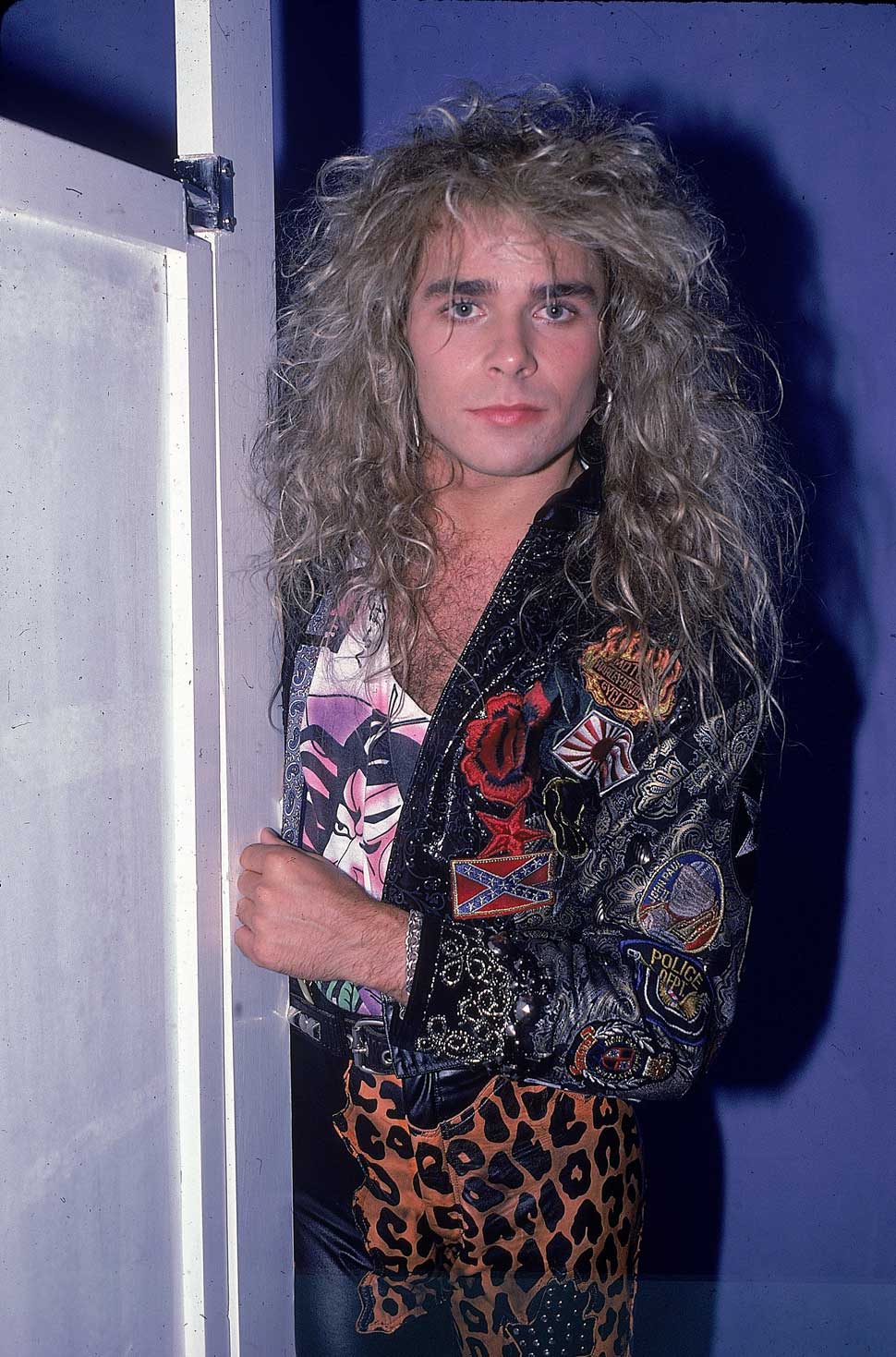 Mike Tramp poses for a portrait in a bathroom stall in July 1987 in New York City, New York