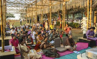 An example of a typical community meeting under one of the open-air pop-ups in Mumbai