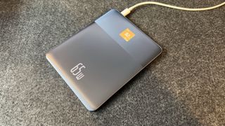 Baseus Blade 2 65W Smart Power bank on grey fabric surface