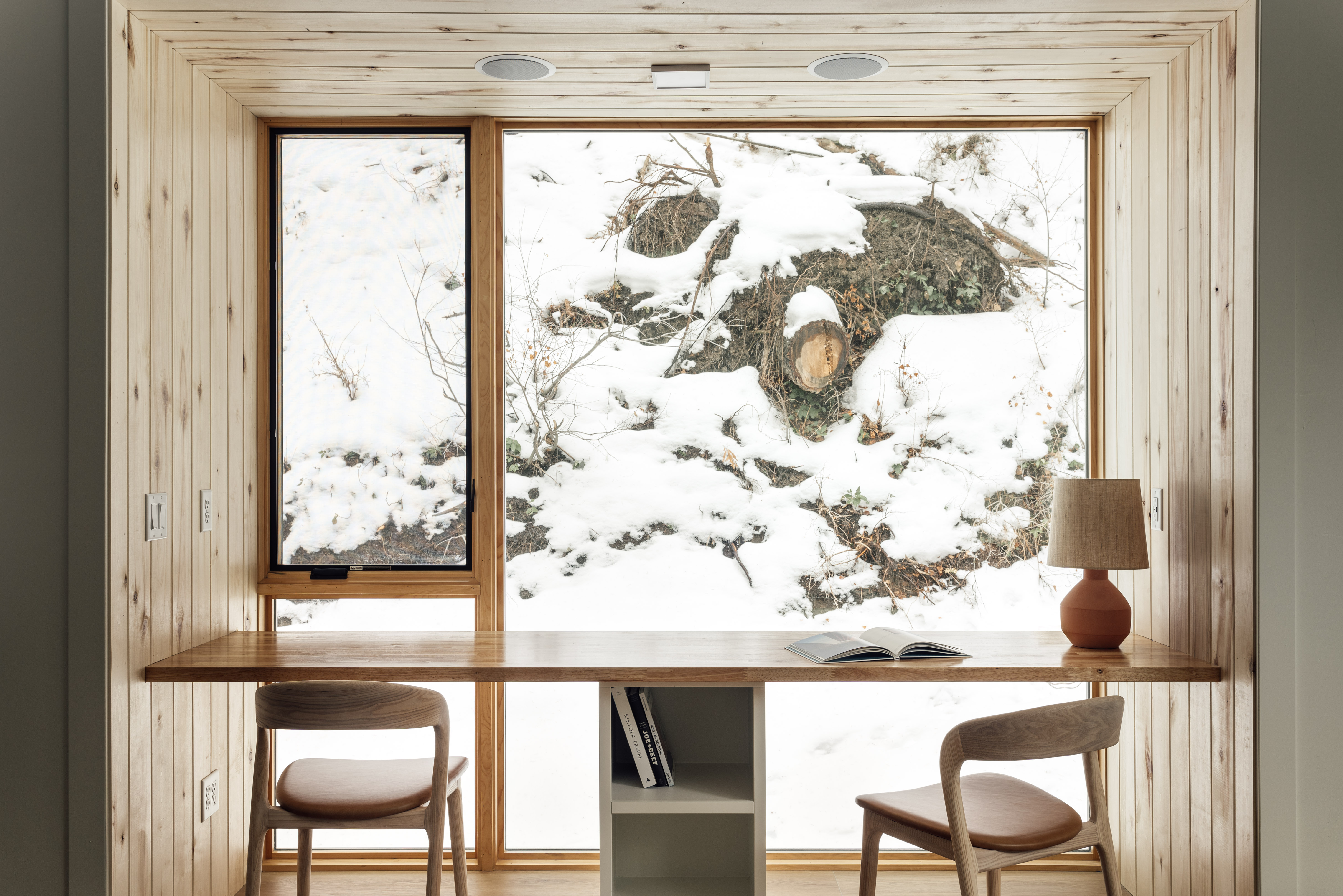 Parkview Mountain House by Mattaforma, a wooden house in a forest, snowy views