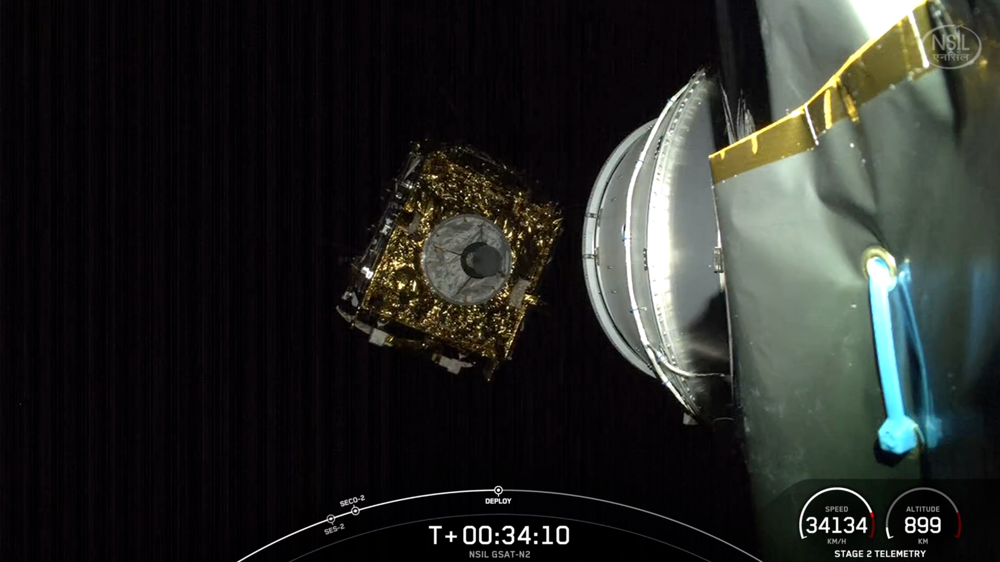 a golden, cubical satellite deploys from the upper stage of its rocket in earth orbit