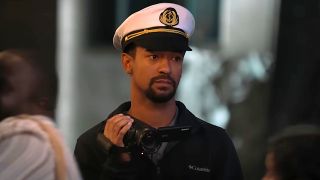 Anthony Norman wears the Captain Fun hat while holding a camcorder on Jury Duty Presents: Company Retreat.