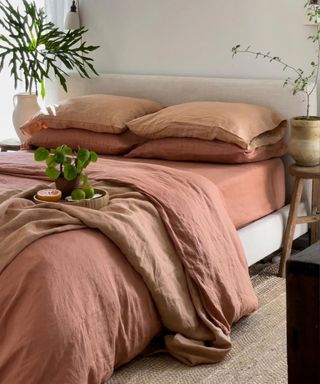 Hazelnut 100% French Flax Linen Bedding Bundle on a bed against a white wall.