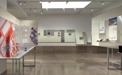 Architectural sketches and images on display in a gallery