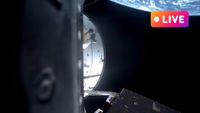 orion capsule in space with earth in the background there is a live text in top right corner to convey the live blog nature of the article.