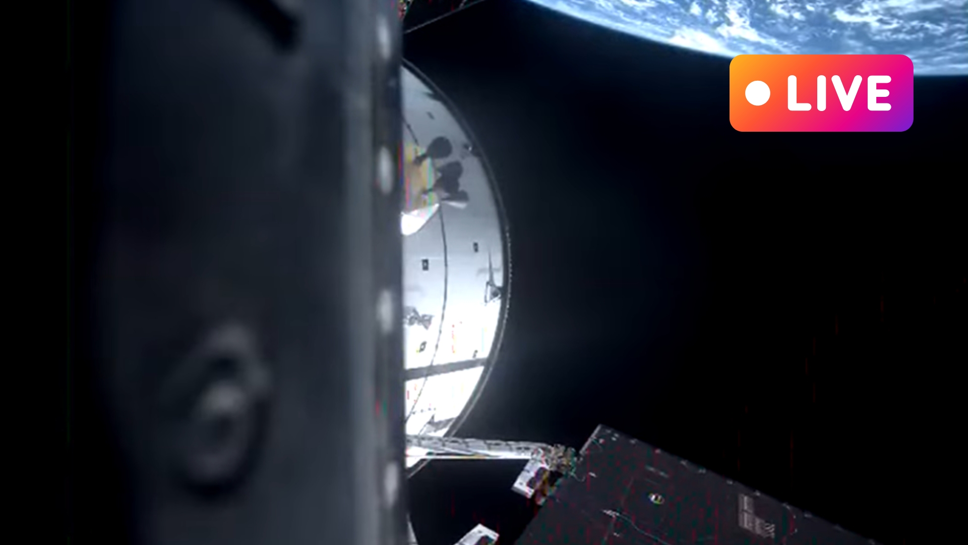 orion capsule in space with earth in the background there is a live text in top right corner to convey the live blog nature of the article.