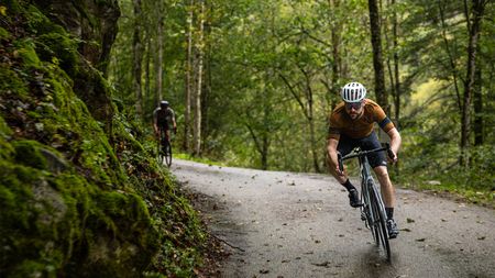 Scott Addict eRide being ridden on a road in a forest