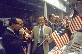 Chris Kraft joins in the celebration for the successful conclusion of the Apollo 11 moon landing mission in Mission Control.
