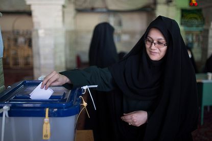 Iranians vote in election.