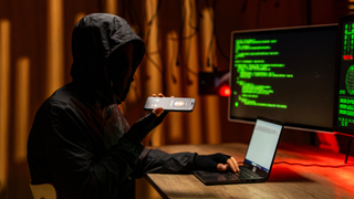 a hacker calling a scam victim