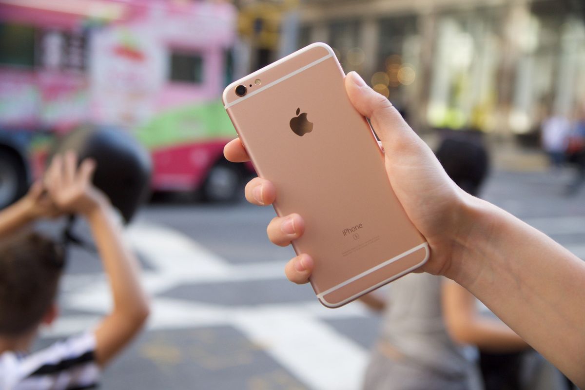 Free Photo  Happy beautiful girl playing mobile video game, holding  smartphone horizontally, watching on cellphone with excited face, pink  background.