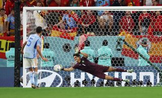 Sergio Busquets sees his penalty saved by Yassine Bounou as Spain lose to Morocco in a shootout in the last 16 of the 2022 World Cup.