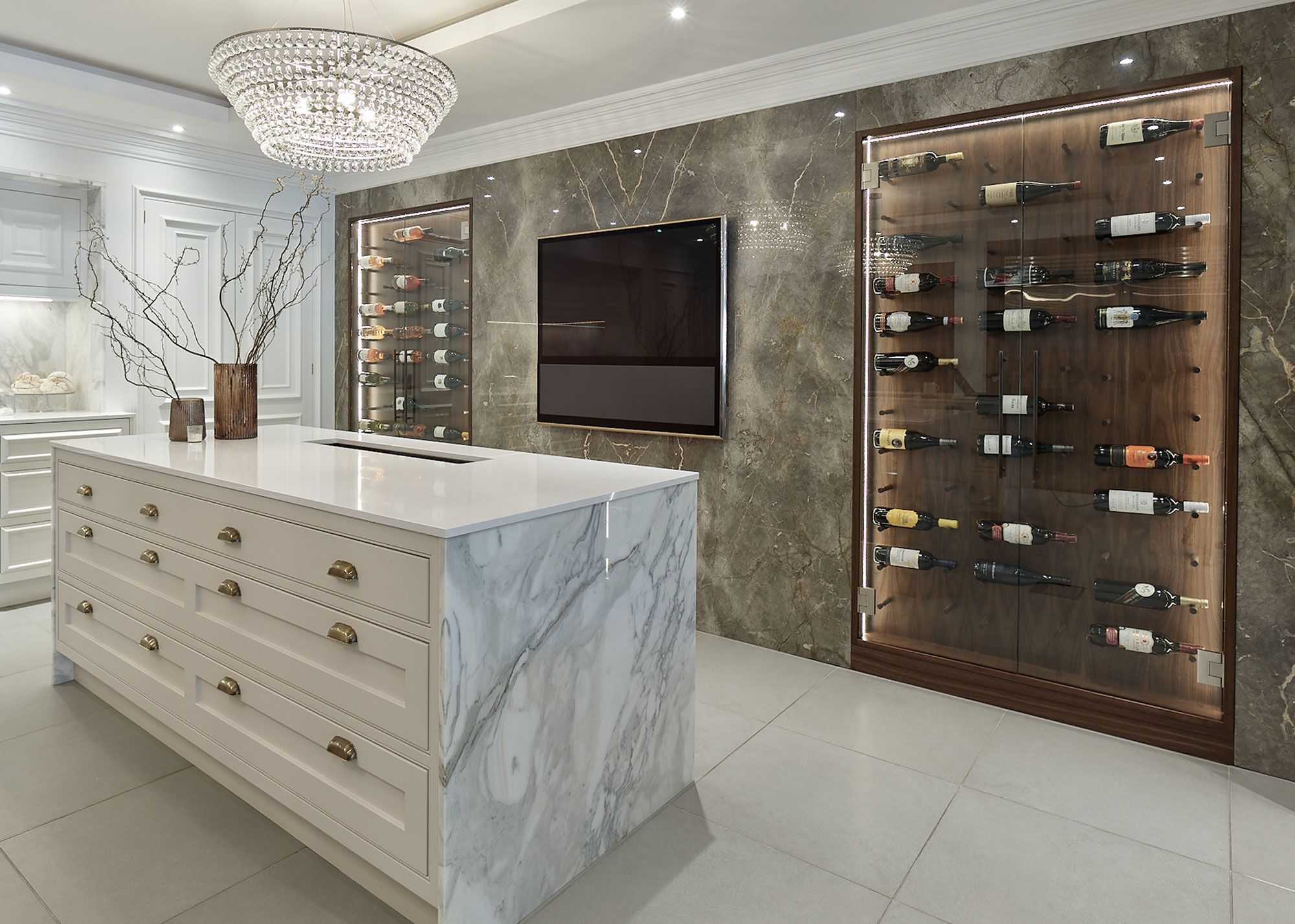 modern white kitchen with twin wine walls and kitchen island with drawers and marble work surfaces