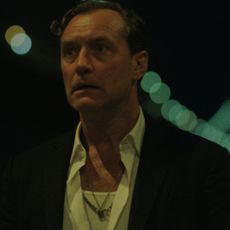 jude law as jake looking shocked in black rabbit