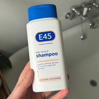 Laura holding E45 Dry Scalp Shampoo