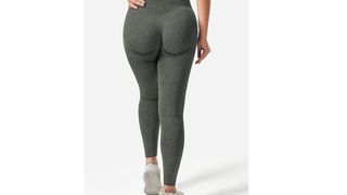 A person from the back wearing green contour leggings for the best leggings on Amazon.