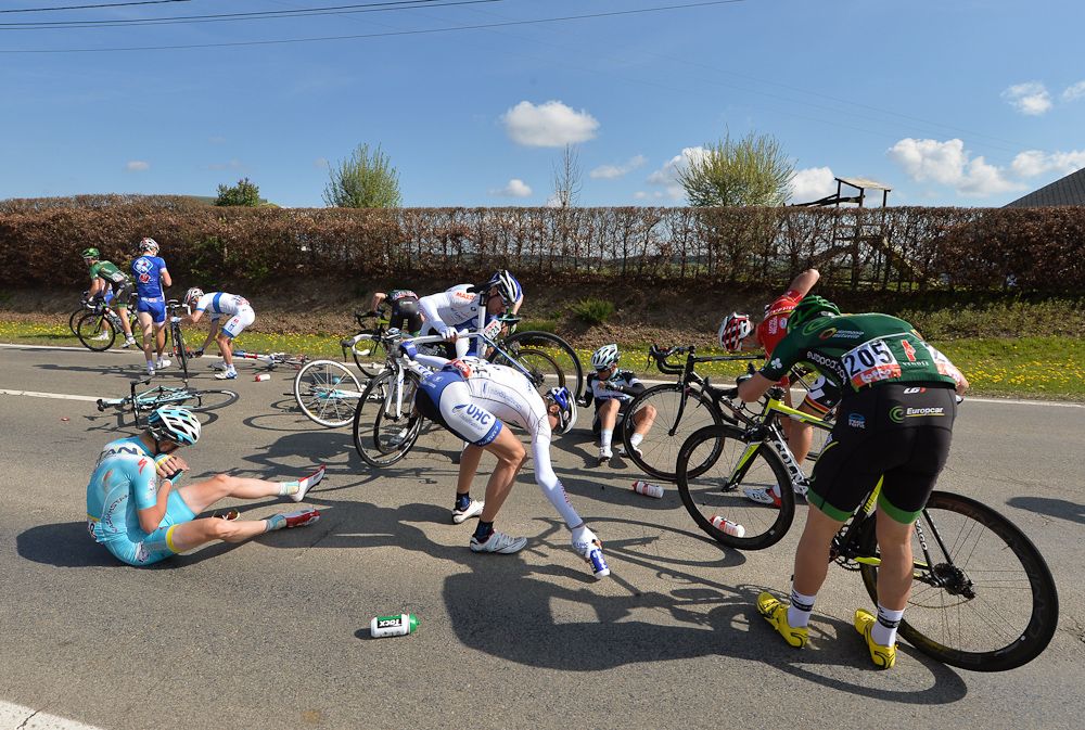Eduard Vorganov (Team Katusha), Marc de Maar (United Healthcare ProCycling Team) and Christophe Kern (Team Europcar) react after falling during the 78th 'La Fleche Wallonne' in 2014.