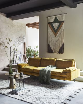 yellow living room with boho feel and mustard sofa