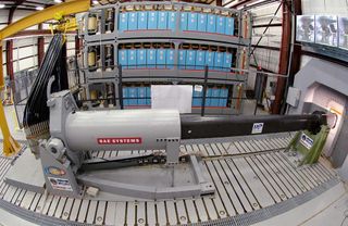 Engineers at Naval Surface Warfare Center, Dahlgren Division, prepare to test the Office of Naval Research-funded electromagnetic railgun prototype launcher that was recently installed at a test facility in Dahlgren, Va.