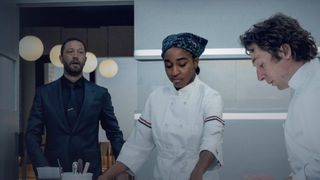 Carmy (Jeremy Allen White), Syd (Aya Edebiri) and Richie (Ebon Moss-Bachrach) in the kitchen in The Bear season 4