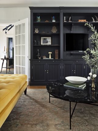 Modern living room with black built in shelving