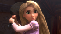 Rapunzel with a frying pan in her hands in Tangled