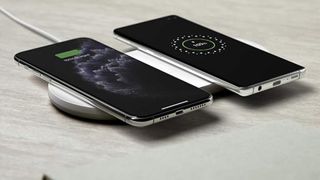 A Belkin wireless charger, charging two phones