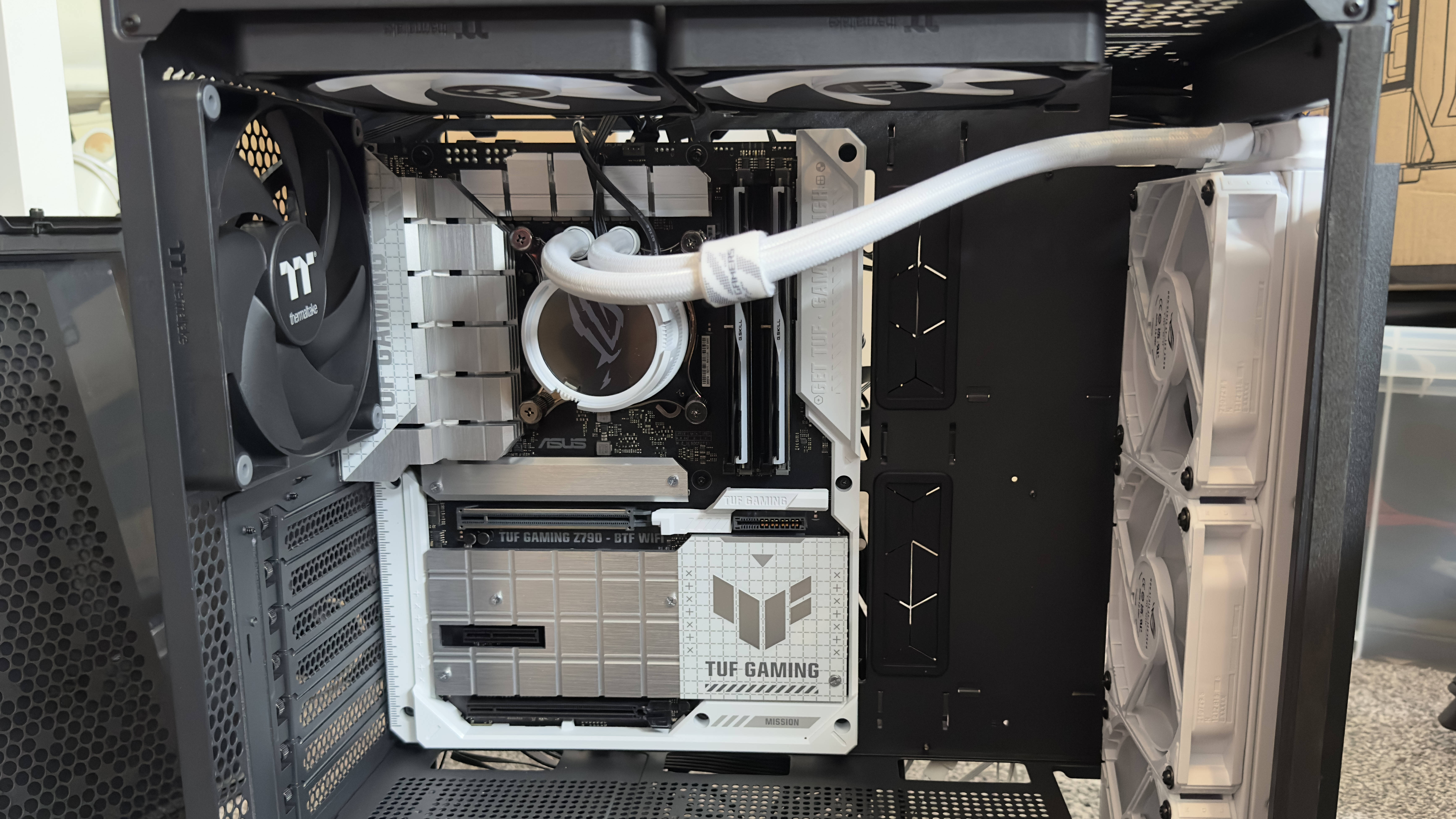 A photo of a gaming PC being built, using Asus BTF hardware