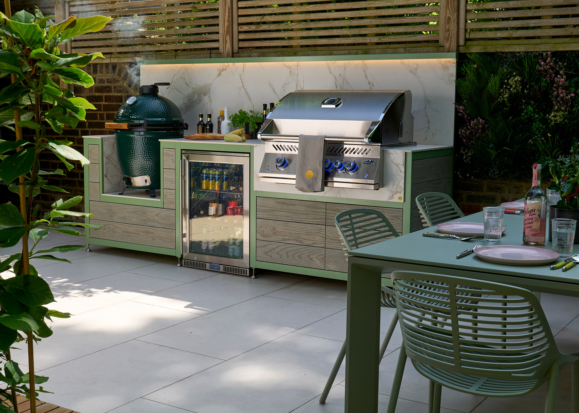 EO outdoor kitchen with a large grill and Big Green Egg