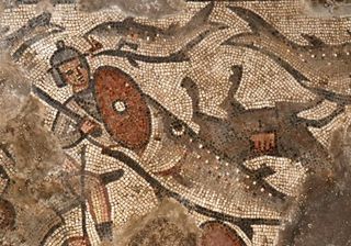 A mosaic floor panel depicts soldiers being swallowed by large fish, surrounded by overturned chariots in the parting of the Red Sea