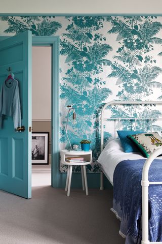 Blue wallpapered bedroom